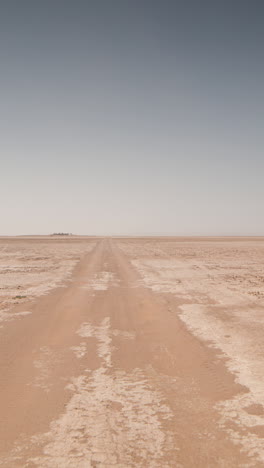 driving in sahara desert, morocco in vertical