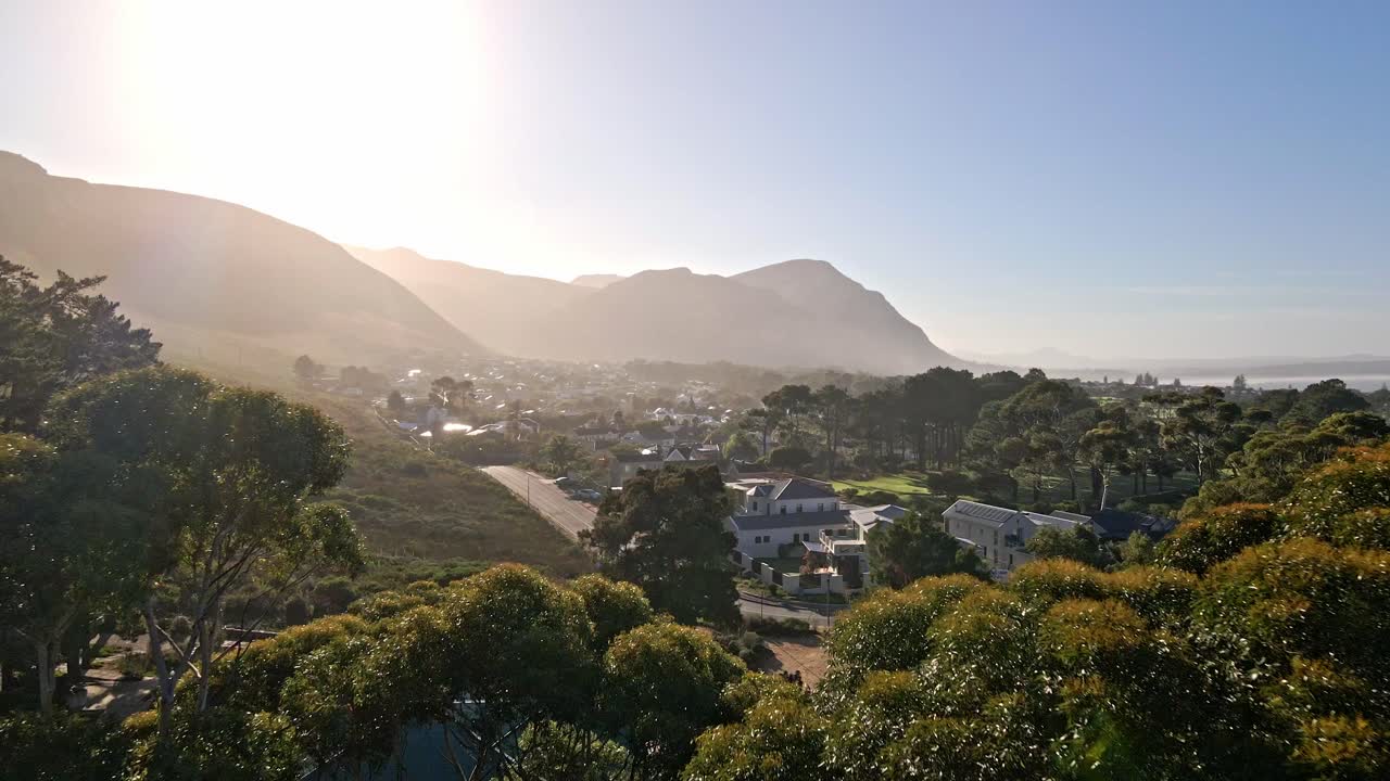 A scene of mountains and trees at sunrise in Hermanus South Africa