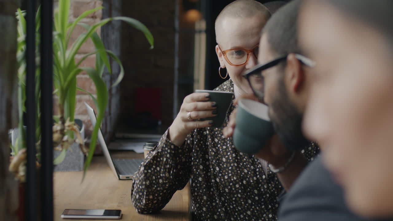 Friends Meeting Over Coffee at a Cafe