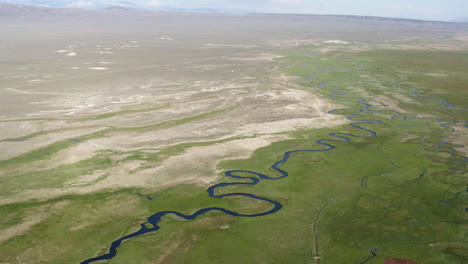 aerial drone footage view of owens river benton crossing, land, grass and river