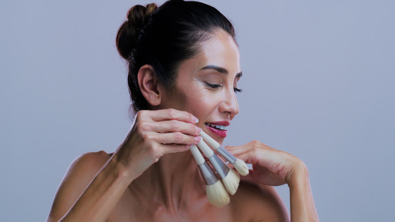 Woman Applying Makeup with Brushes