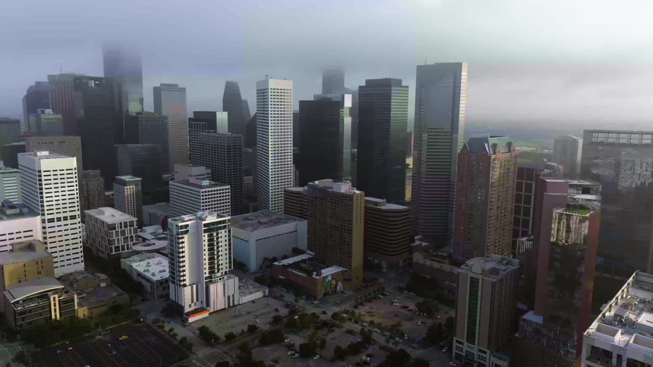 Establishing drone shot of downtown Houston city, misty morning in Texas, USA