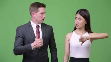 multi-ethnic business couple having different decisions