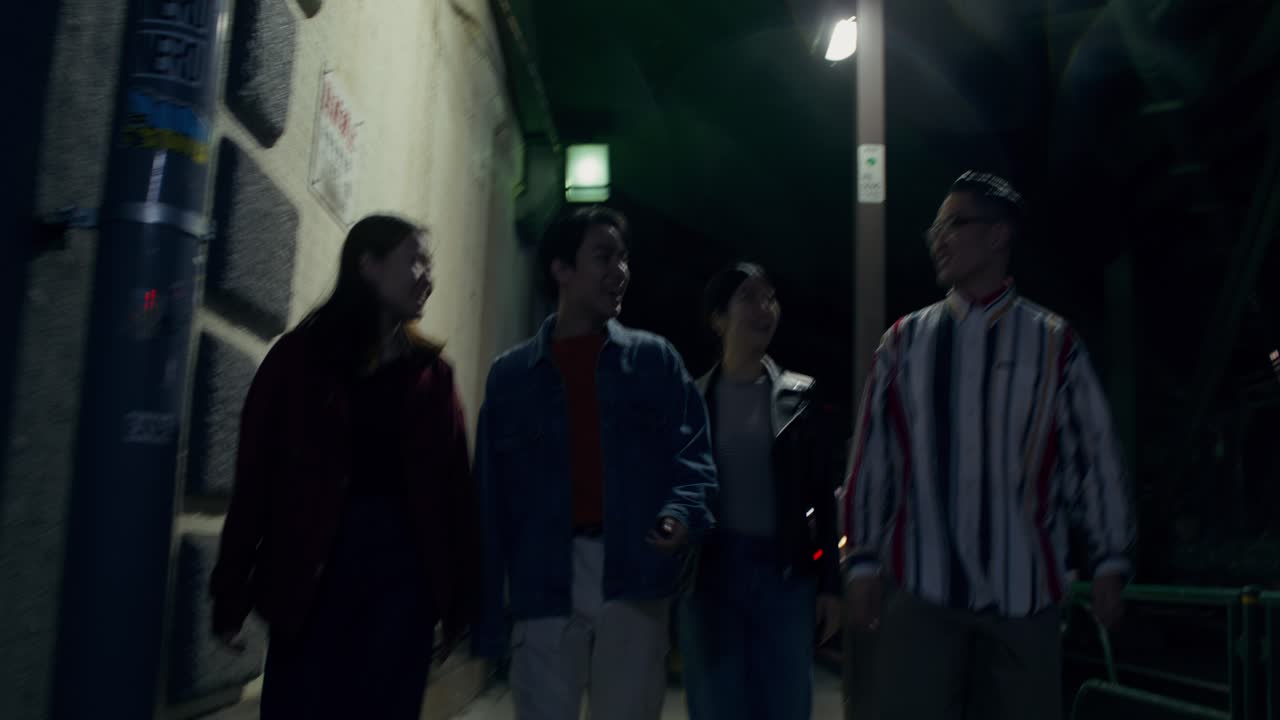 Four Friends Walking at Night