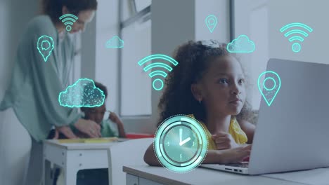 animation of internet icons over happy biracial schoolgirl using laptop in diverse