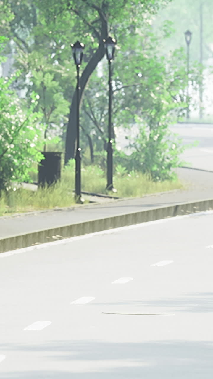 Quiet morning walk along a lush green park pathway in springtime