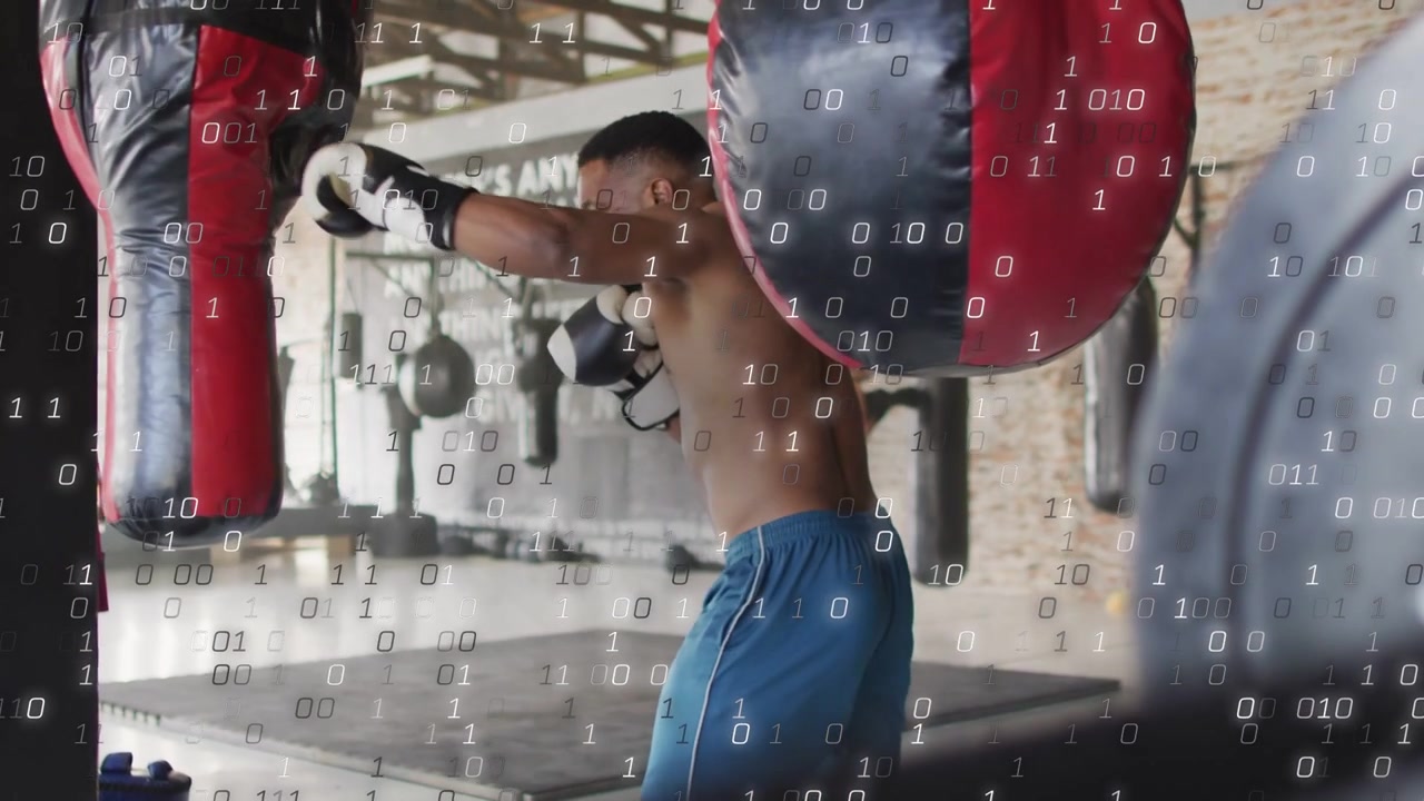 Boxer initiating boxing gym drill by striking bag shifting feet with binary densifying over scene