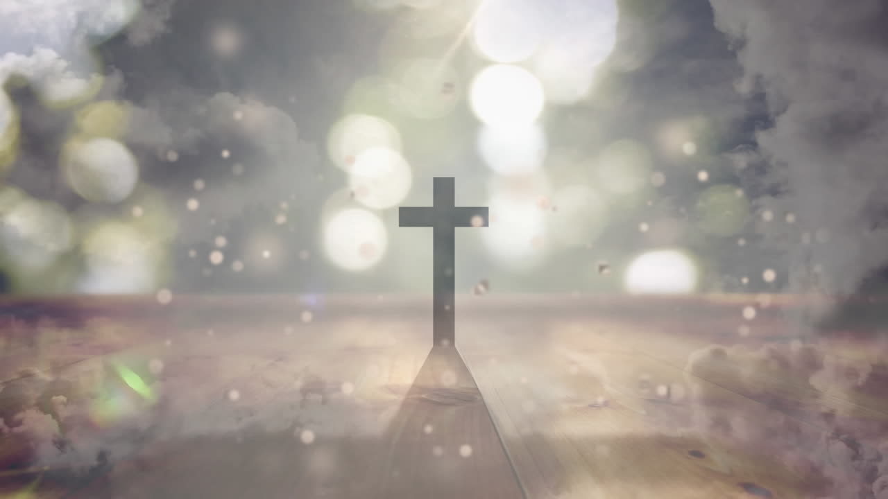 십자가와 구름 위의 빛 반점의 애니메이션