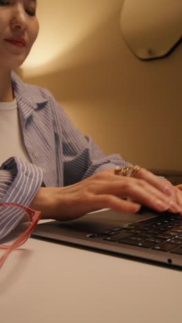 woman working on a laptop at home