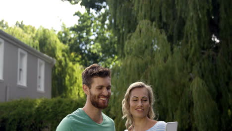 Young-couple-taking-a-picture-with-their-smartphone