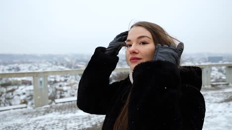 slow motion of a close up of a thoughtful model walking in snowy winter