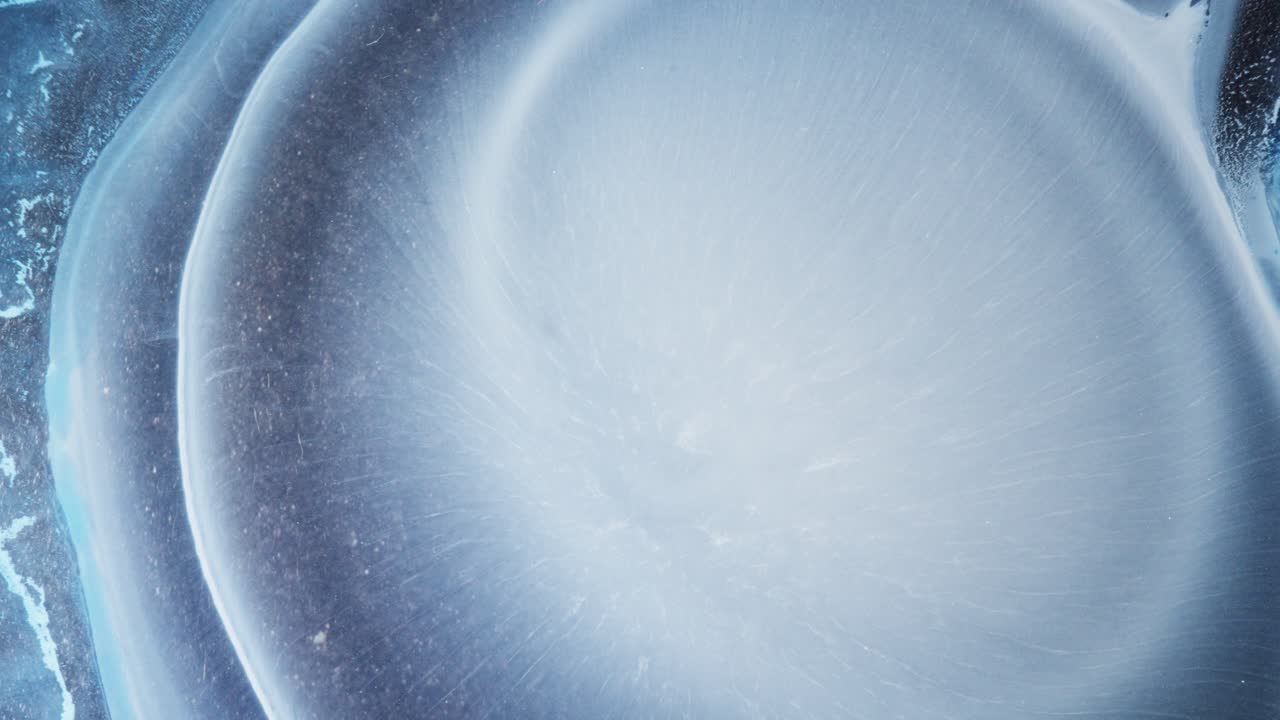 Ethereal white ink bloom in liquid, macro shot with dreamy and tranquil aesthetic