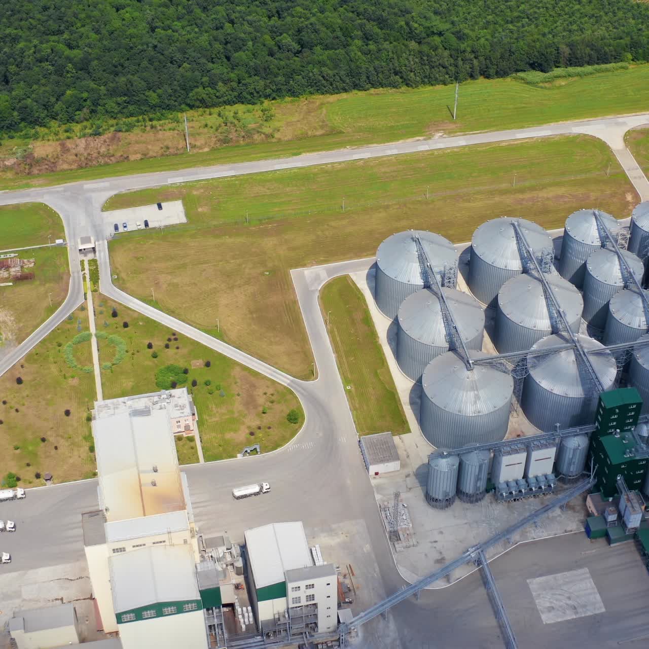 Modern industrial grain elevator storage. Aerial view of big factory storages