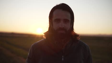 man at sunset in a field