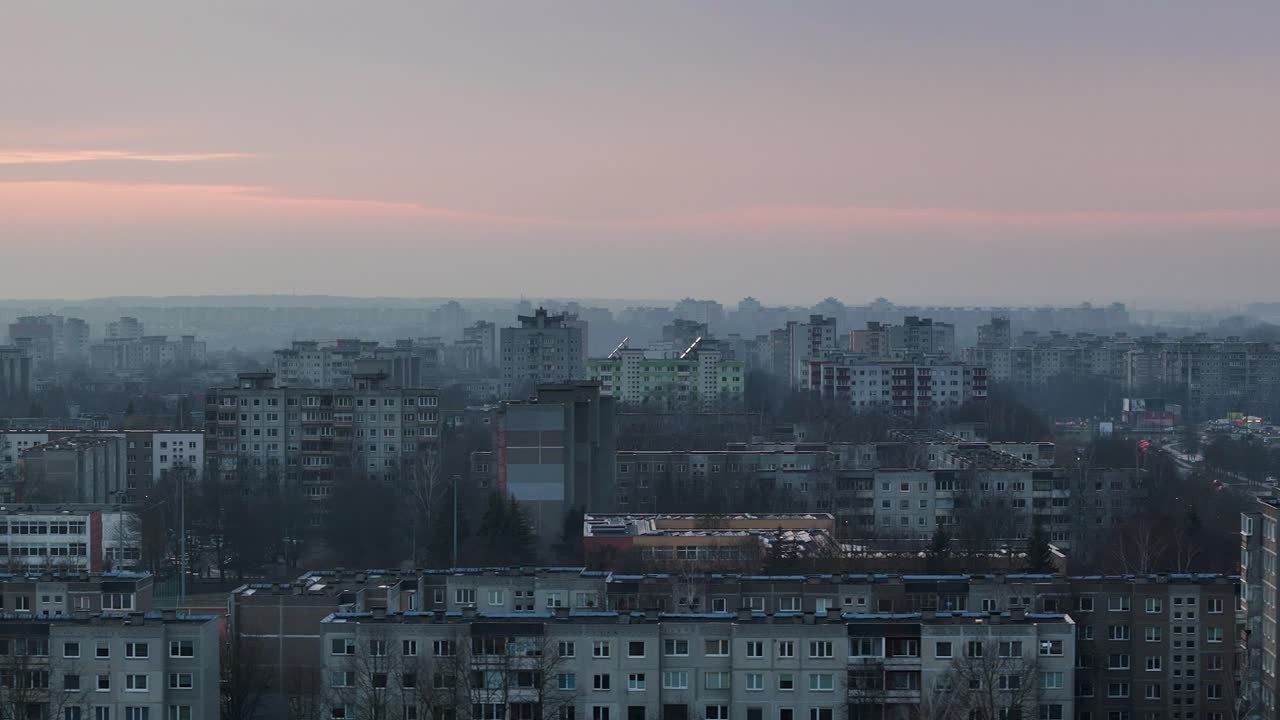 Misty evening over apartment buildings in Kaunas, aerial view