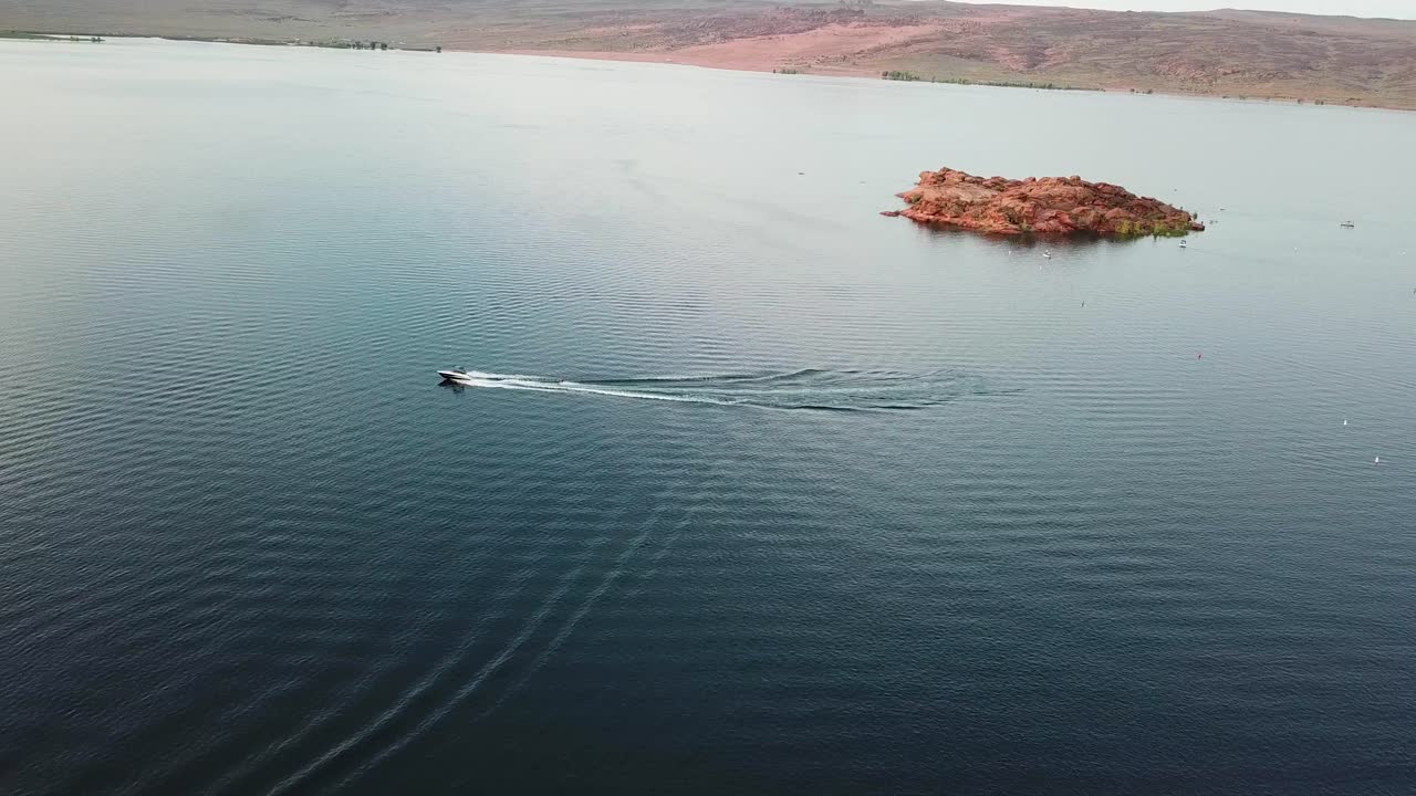 Aerial View Speedboat Sailing in Water Reservoir Lake of Sand Hollow National Park, Utah USA