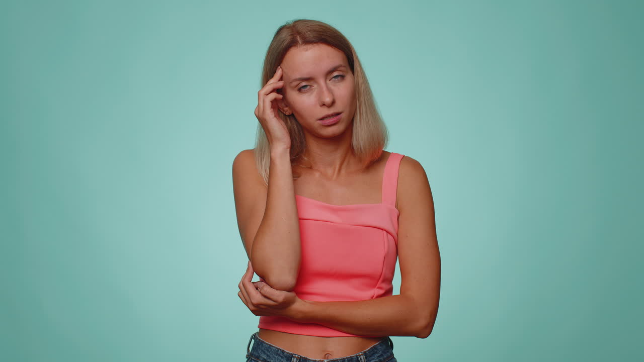 Woman rubbing temples to cure headache problem, suffering from tension and migaine, stress, pain