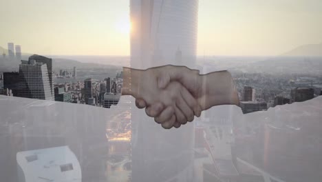 animation of cityscape over business people shaking hands