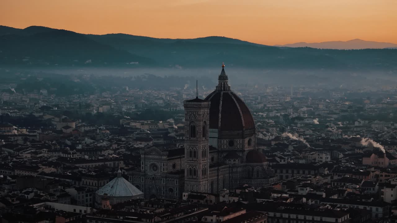 Circle left around Florence Duomo as golden sunrise lights the city