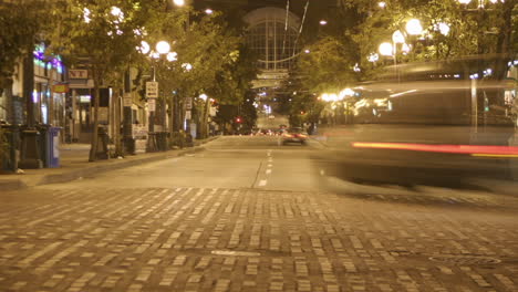 traffic drives through a downtown area in time lapse