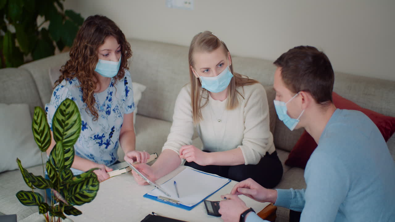 Meeting in a room while wearing face masks