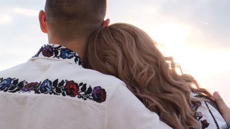 a couple is joyfully running outdoors during a beautiful sunset both dressed in active wear a joyful couple jogs on a scenic sunset path showcasing their athletic gear and commitment to a healthy life