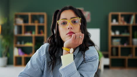 portrait of a pensive woman wearing glasses