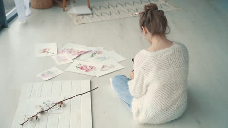 Young-Female-Creator-Taking-Photos-Of-Her-Illustrations-2