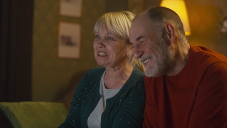 elderly couple watching tv