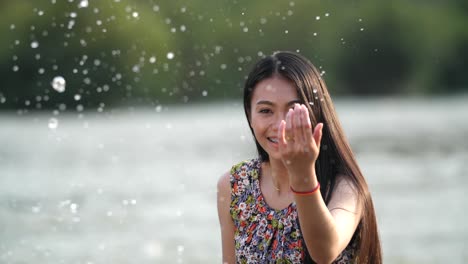woman smiling by a river