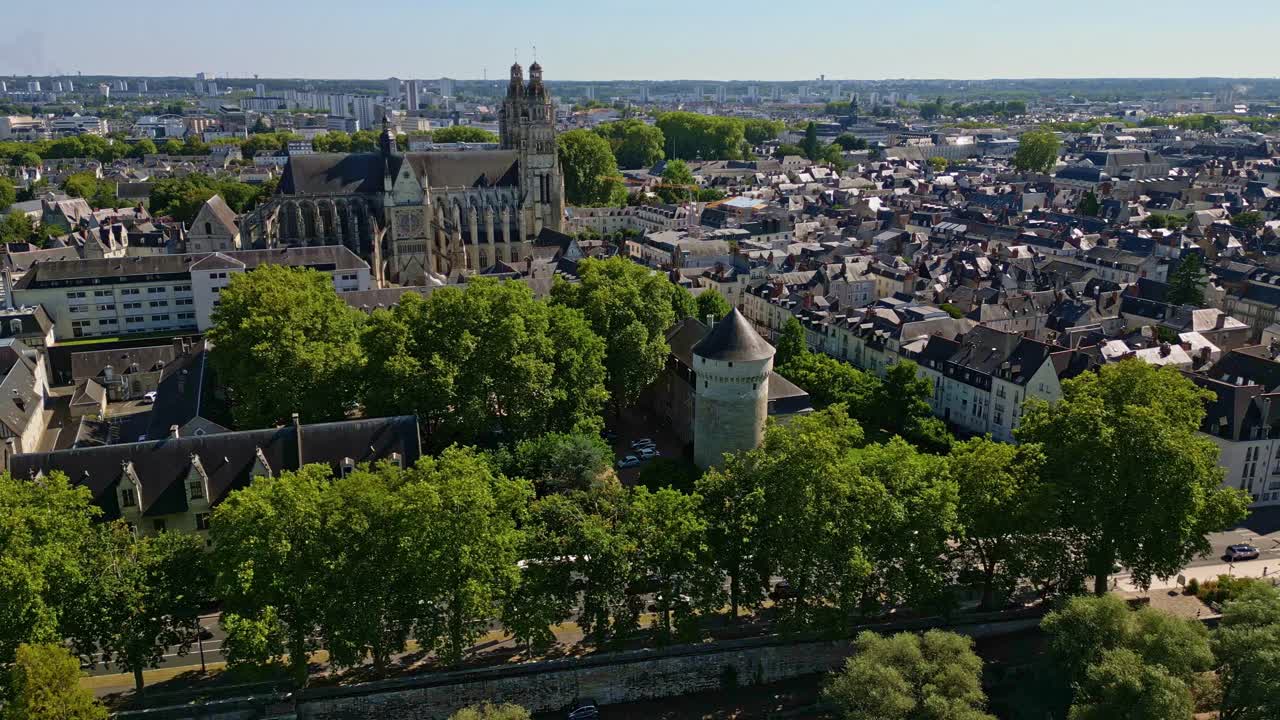Tours cityscape, Saint-Gatien Cathedral, and Château de Tours, historic architecture in Loire Valley on sunny day, France. Aerial drone lateral view