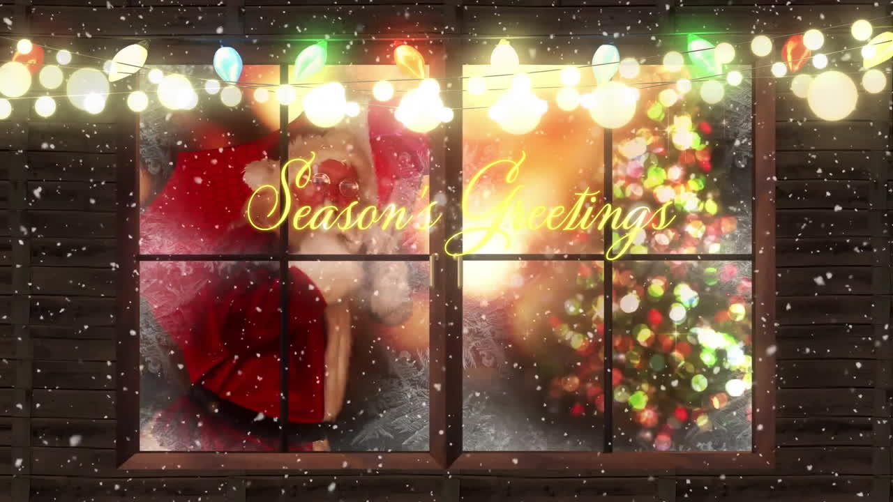 Animation of Christmas tree and lights visible through snowy window with greetings