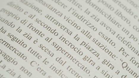 Close-up of a book page with Italian text
