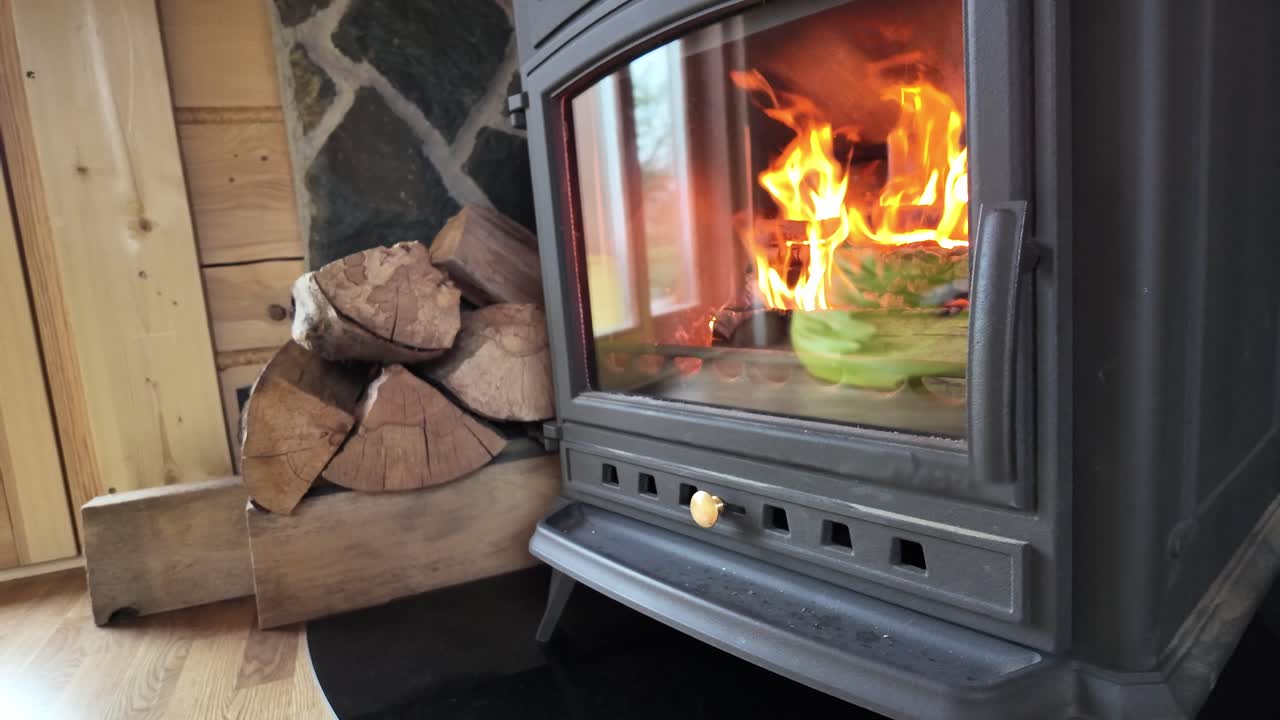 A cozy house with a fire burning in the fireplace - 4K