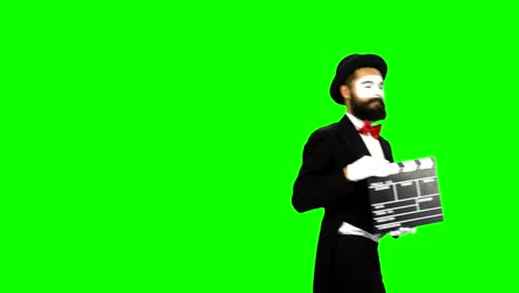 mime holding clapperboard on green screen
