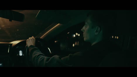 man driving at night