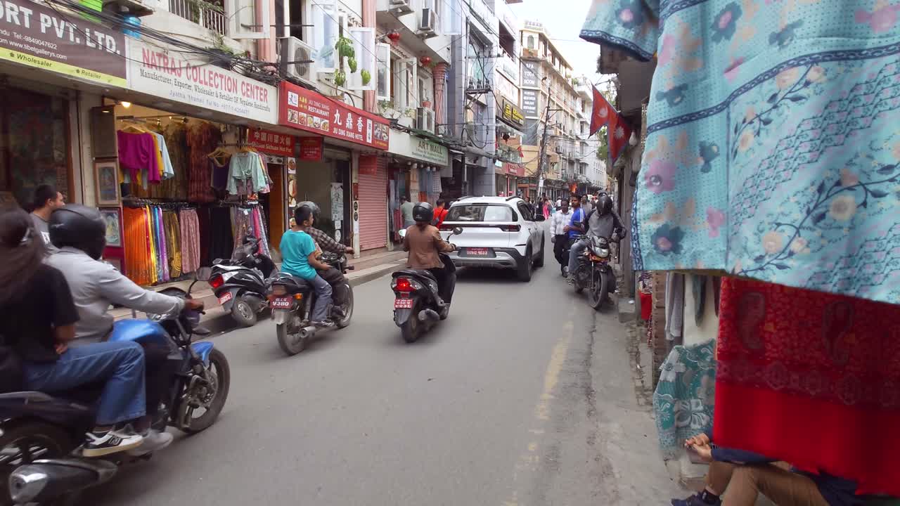 People At The Busy Streets Of Kathmandu City Center In Thamel District, Nepal. Static Shot