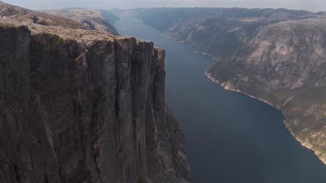 stunning aerial view of kjeragbolten norwegian fjords with rocky cliffs and calm water below