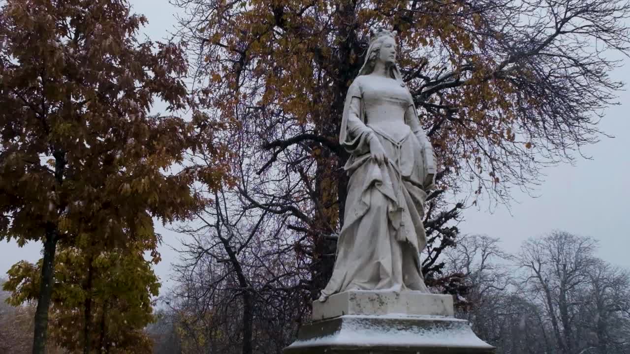 Slow Motion Snowfall on Statue in Luxembourg Gardens, Paris