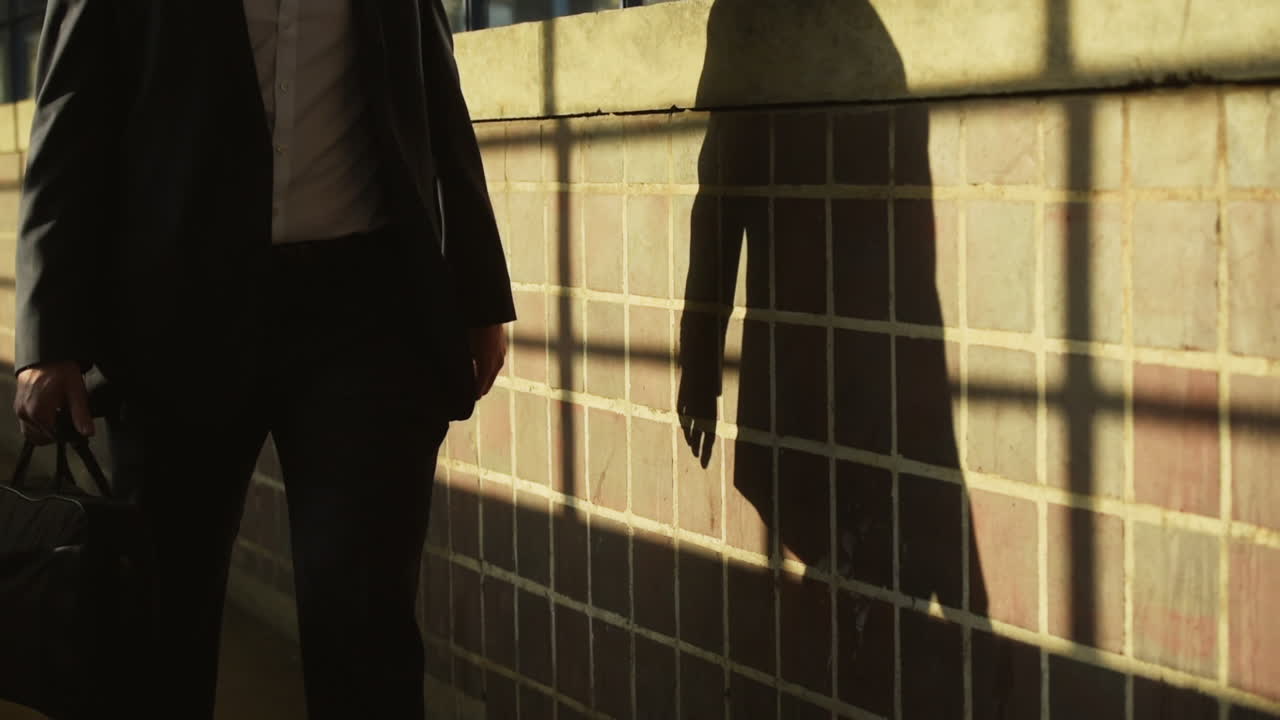 A businessman walking to work or commuting with a briefcase