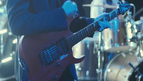 guitar player on stage at a concert rocking the audience