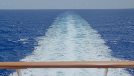 Slow-dolly-of-vast-caribbean-ocean-from-back-of-ship