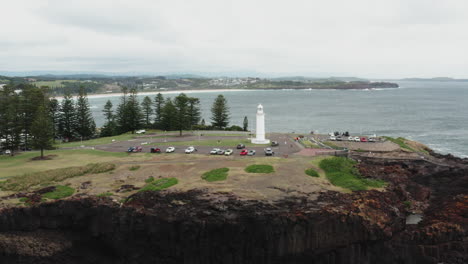 aerial drone shot descending towards kiama lighthouse, south coast new south wales, australia