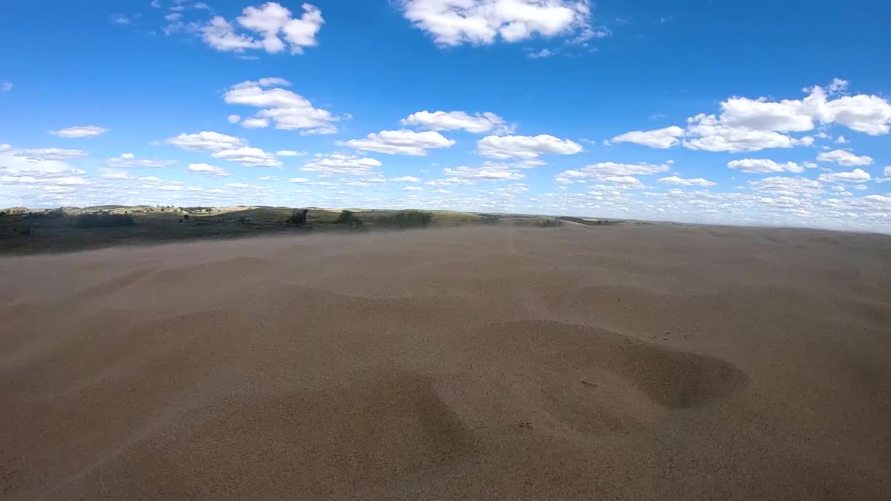 Desert and sand dunes on a cloudy sunny day in Alberta Canada.