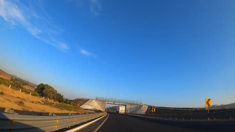 driving through a mexican highway at sunset