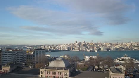 aerial view of istanbul turkey waterfront on bosporus strait, residental buildings and skyline with galata tower