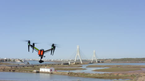 drone flight over river and bridge