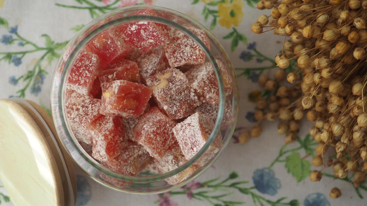 Turkish Delight in a Glass Jar on a Floral Tablecloth