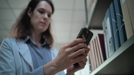 doctor using mobile phone in an office or library