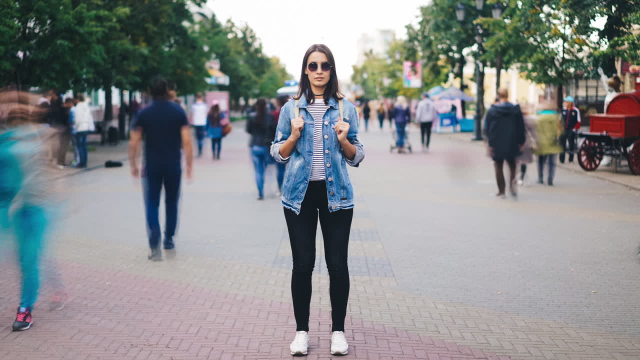 Woman with Backpack on a City Street